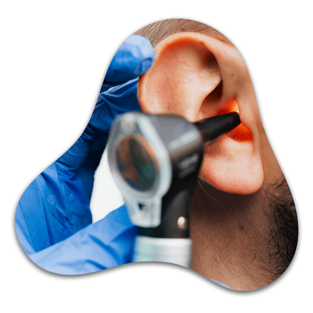Person holding otoscope to ear during medical examination or hearing assessment